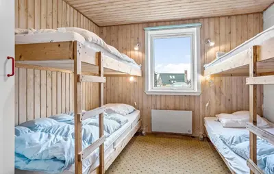 a bunk bed room with two bunk beds and a window at Beautiful Home In Thisted in Thisted