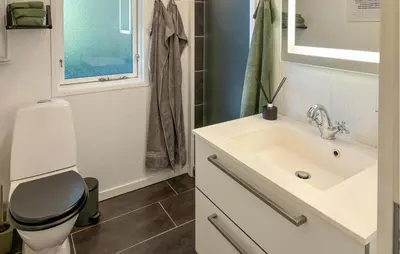 a bathroom with a sink and a toilet at Awesome Home In Hjerm With Wifi in Hjerm