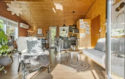 a living room with a couch and a table at 2 Bedroom Nice Home In Løgstør in Løgstør