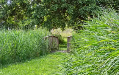 a small fence in the middle of a field of grass at Three-Bedroom Holiday Home Thyholm With A Fireplace 06 in Thyholm