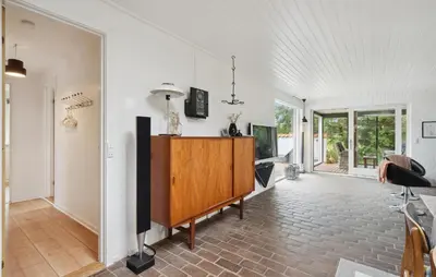 an open living room with a tv and a desk at Three-Bedroom Holiday Home Thyholm With A Fireplace 06 in Thyholm