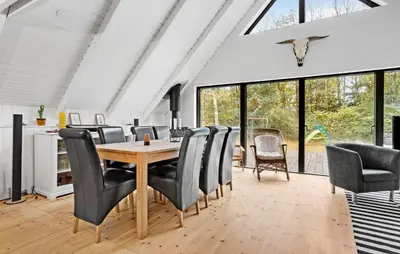 a dining room with a table and chairs at 3 Bedroom Lovely Home In Spøttrup in Spottrup