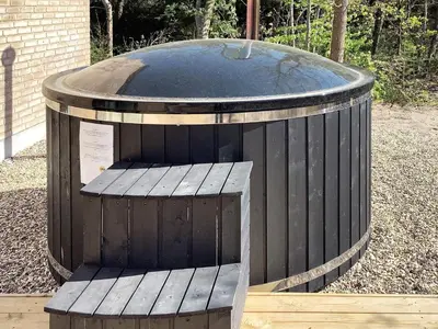 a large wooden barrel with a sign on it at 5 star holiday home in Vestervig-By Traum in Vestervig