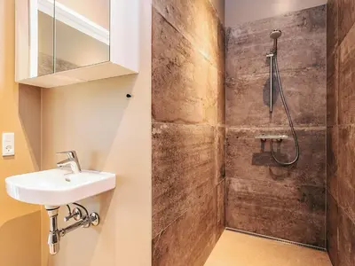a bathroom with a sink and a shower at 5 star holiday home in Højslev in Højslev