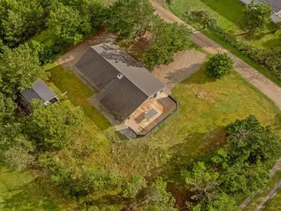an overhead view of a house with a solar array in a field at Holiday Home Skrollan - 200m to the fjord by Interhome in Sindrup