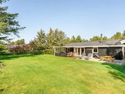 a house with a large yard in front of it at Holiday Home Rajna - 500m to the fjord by Interhome in Vestervig