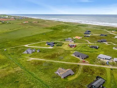 an aerial view of a farm near the ocean at Holiday Home Märta - 250m from the sea by Interhome in Lemvig