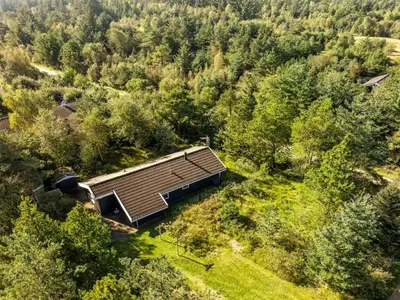 an overhead view of a house in the middle of a forest at Holiday Home Matthea - 900m from the sea by Interhome in Fjerritslev