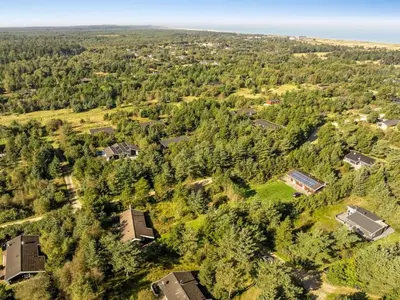 an aerial view of a forest with houses at Holiday Home Matthea - 900m from the sea by Interhome in Fjerritslev