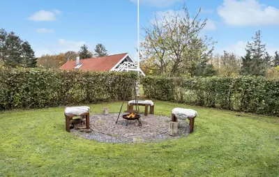 a fire pit in the middle of a yard at Cozy Home In Spøttrup With Wifi in Spottrup