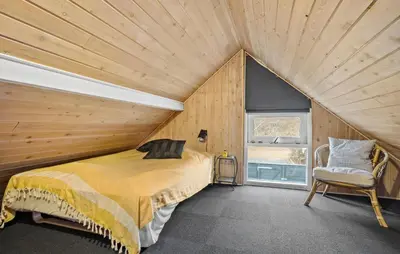 a bedroom with a bed and a window in a room at Cozy Home In Spøttrup With Wifi in Spottrup