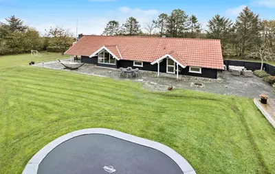 an aerial view of a house with a trampoline at Cozy Home In Spøttrup With Wifi in Spottrup
