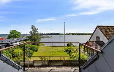 a view of a river from the balcony of a house at Amazing Home In Hurup Thy in Doverodde