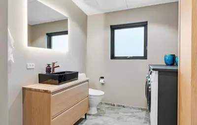 a bathroom with a sink and a toilet at 3 Bedroom Stunning Home In Løgstrup in Løgstrup
