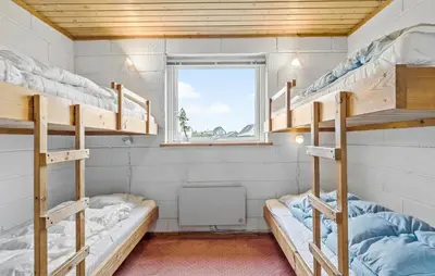 a room with two bunk beds and a window at 2 Bedroom Cozy Home In Thisted in Thisted