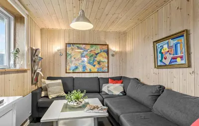 a living room with a couch and a table at 2 Bedroom Cozy Home In Thisted in Thisted