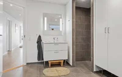 a bathroom with a sink and a shower at Cozy Home In Hanstholm With Wifi in Hanstholm