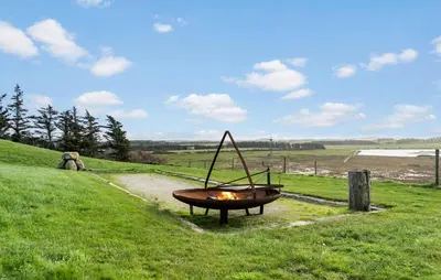 a fire pit in the middle of a field at Cozy Home In Hanstholm With Wifi in Hanstholm