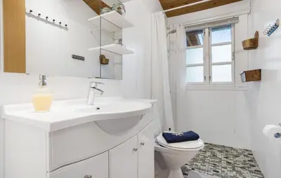 a white bathroom with a sink and a toilet at 3 Bedroom Nice Home In Roslev in Roslev