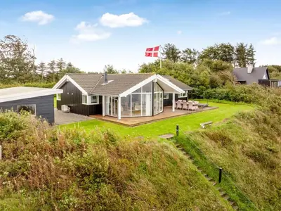 a house on the side of a hill at Holiday Home Næwe - 10m to the fjord by Interhome in Roslev