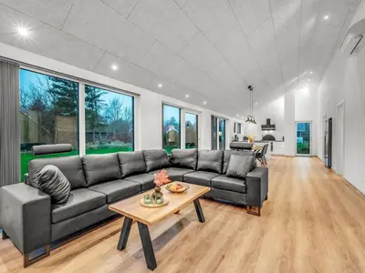 a living room with a couch and a table at Holiday Home Grimar - 400m to the fjord by Interhome in Vemb