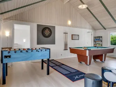 a billiard room with two tables and a pool table at Holiday Home Eftim - 500m from the sea by Interhome in Harboør