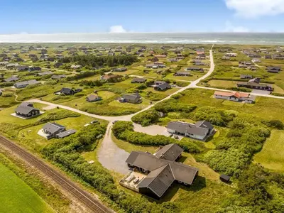 an aerial view of a subdivision of houses on the beach at Holiday Home Eftim - 500m from the sea by Interhome in Harboør