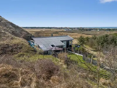 an aerial view of a house on a hill at Holiday Home Sella - 600m from the sea by Interhome in Blokhus