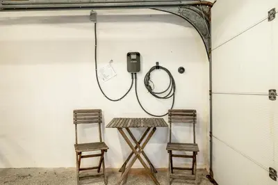two chairs and a phone and a table in a garage at Lovely Holiday House With 4 Rooms Close To The North Sea in Frøstrup