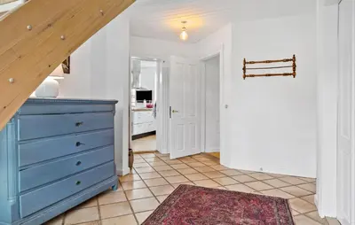 a hallway with a blue dresser in a room at 5 Bedroom Lovely Home In Bøvlingbjerg in Bøvlingbjerg