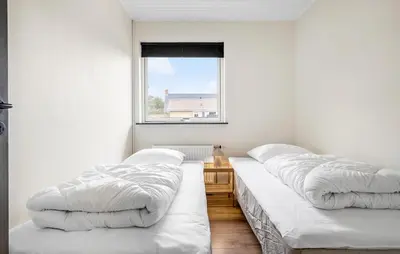 three beds lined up in a room with a window at Amazing Home In Vestervig With Wifi in Vestervig