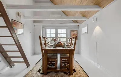 a dining room with a wooden table and chairs at Pet Friendly Home In Karby in Karby