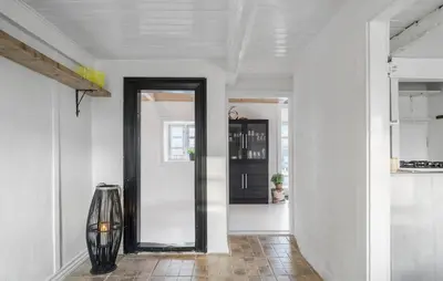 a hallway with a mirror in a room at Pet Friendly Home In Karby in Karby