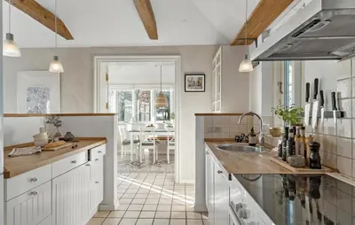 a kitchen with a sink and a counter top at 3 Bedroom Cozy Home In Nibe in Nibe