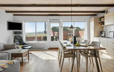 a kitchen and living room with a table and chairs at Amazing Home In Lemvig in Lemvig