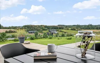a table and chairs on a balcony with a view at Amazing Home In Fjerritslev in Fjerritslev