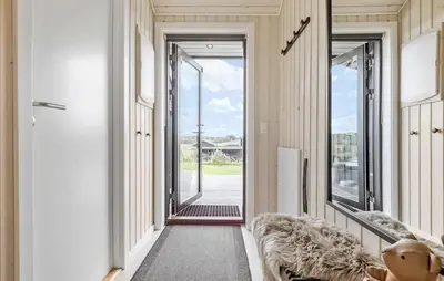 a hallway with a door leading into a house at Amazing Home In Fjerritslev in Fjerritslev