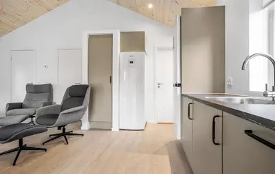 a kitchen with two chairs and a sink at 2 Bedroom Amazing Home In Hurup Thy in Sønder Ydby