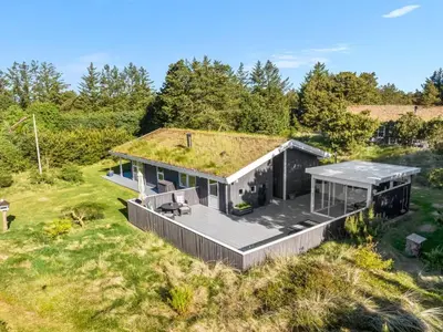 an overhead view of a house with a grass roof at Holiday Home Elisenda - 2-2km from the sea by Interhome in Blokhus