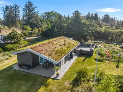 an overhead view of a tiny house with a garden on the roof at Holiday Home Elisenda - 2-2km from the sea by Interhome in Blokhus