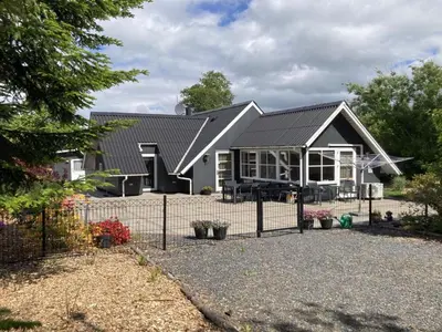 a house with a fence in front of it at Holiday Home Adisl - 600m to the fjord by Interhome in Løgsted