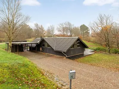a house with a sign in front of it at Holiday Home Jantje - 500m to the fjord by Interhome in Spottrup