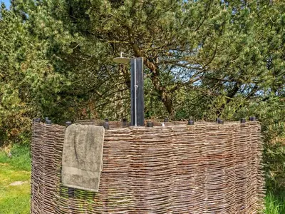 a wicker fence with a light on top of it at Holiday Home Star - 600m from the sea by Interhome in Løkken