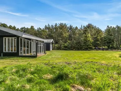 a house with a large yard with grass at Holiday Home Star - 600m from the sea by Interhome in Løkken