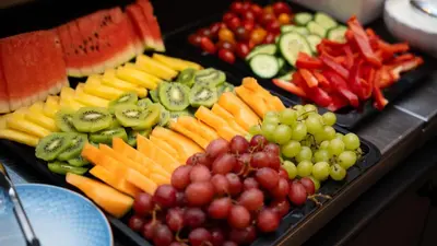 a tray of different types of fruit and vegetables at Cityinn Hotel in Viborg