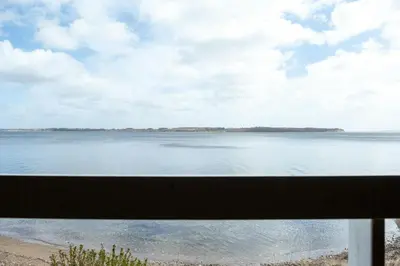 a view of the ocean from a balcony at Nature Gem 5 Metres From Limfjord in Roslev