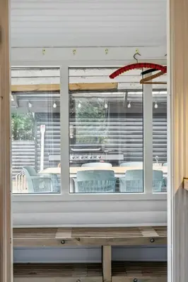 a view of a table and chairs through a window at Warm Colors And Beautiful Outdoors In Thy in Sønder Ydby