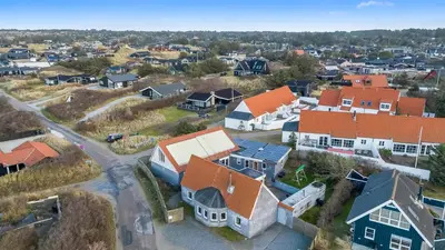 an aerial view of a residential neighborhood with houses at Large Holiday Home With Pool And Spa In The Middle Of Blokhus Town, Close To The North Sea in Blokhus