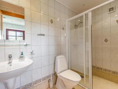 a bathroom with a toilet and a sink and a shower at Charming Retreat in Blokhus - By Traum Ferienwohnungen in Blokhus