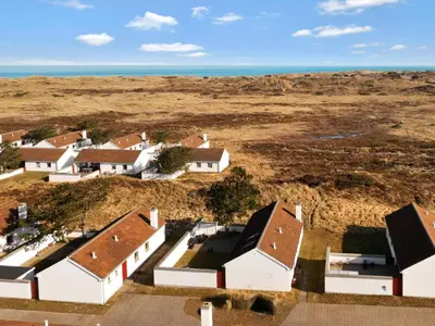 an aerial view of a group of houses in a field at Charming Retreat in Rodhus - By Traum Ferienwohnungen in Pandrup